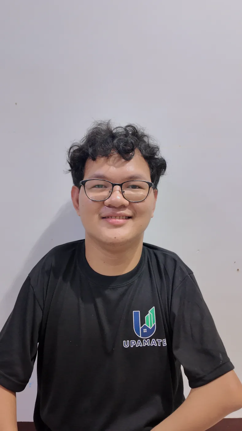 Daniel Zan Baltazar in an UPAMATE shirt, August 2026